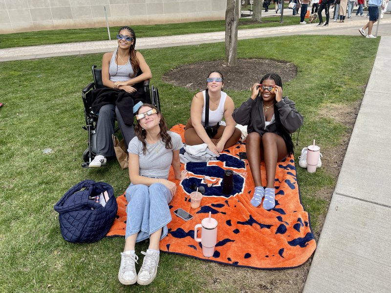 Four girls with Eclipse Glasses SU Blanket