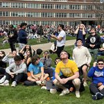 Students looking at sun with glasses