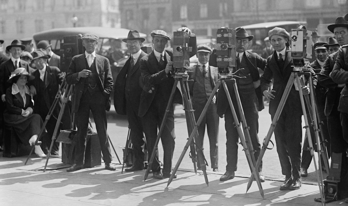Line of photographers in the 1920s.