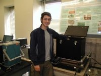 Ryan Badman in high energy physics laboratory