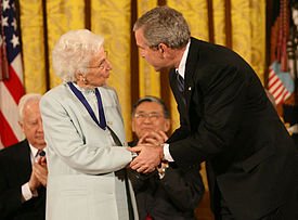 Author Ruth J. Colvin '59, H'84 receiving the 2006 Presidential Medal of Freedom 
