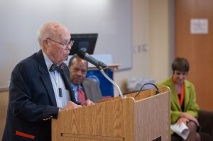 Charles Bishop '42, G'44 says a few words at the induction ceremony for the inaugural Beverely Petterson Bishop Professorship in Neuroscience. Dean George M. Langford and Sandra J. Hewett are in the background.
