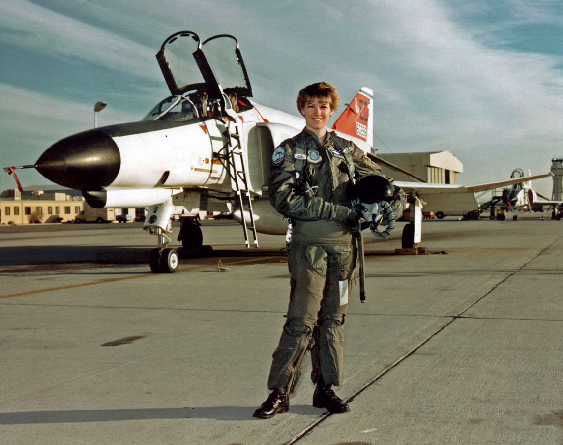 Collins’ Air Force Test Pilot School graduation photo with the F-4 aircraft that she flew throughout the program.