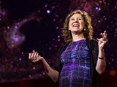 Gabriela González G’95 delivering a TED Talk.