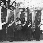 black and white historical photo of suffrage protests