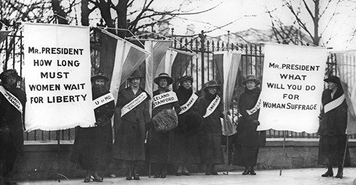 black and white historical photo of suffrage protests
