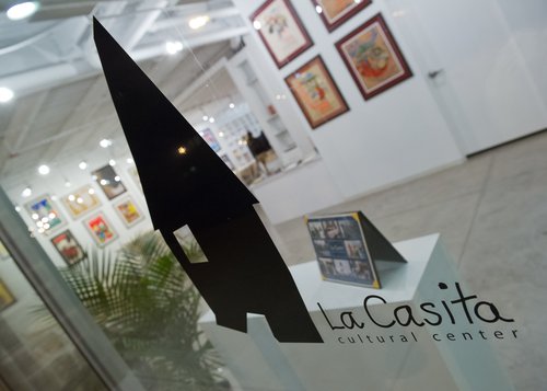 La Casita Cultural Center window sign.