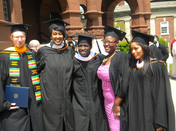 Five students in cap and gowns.