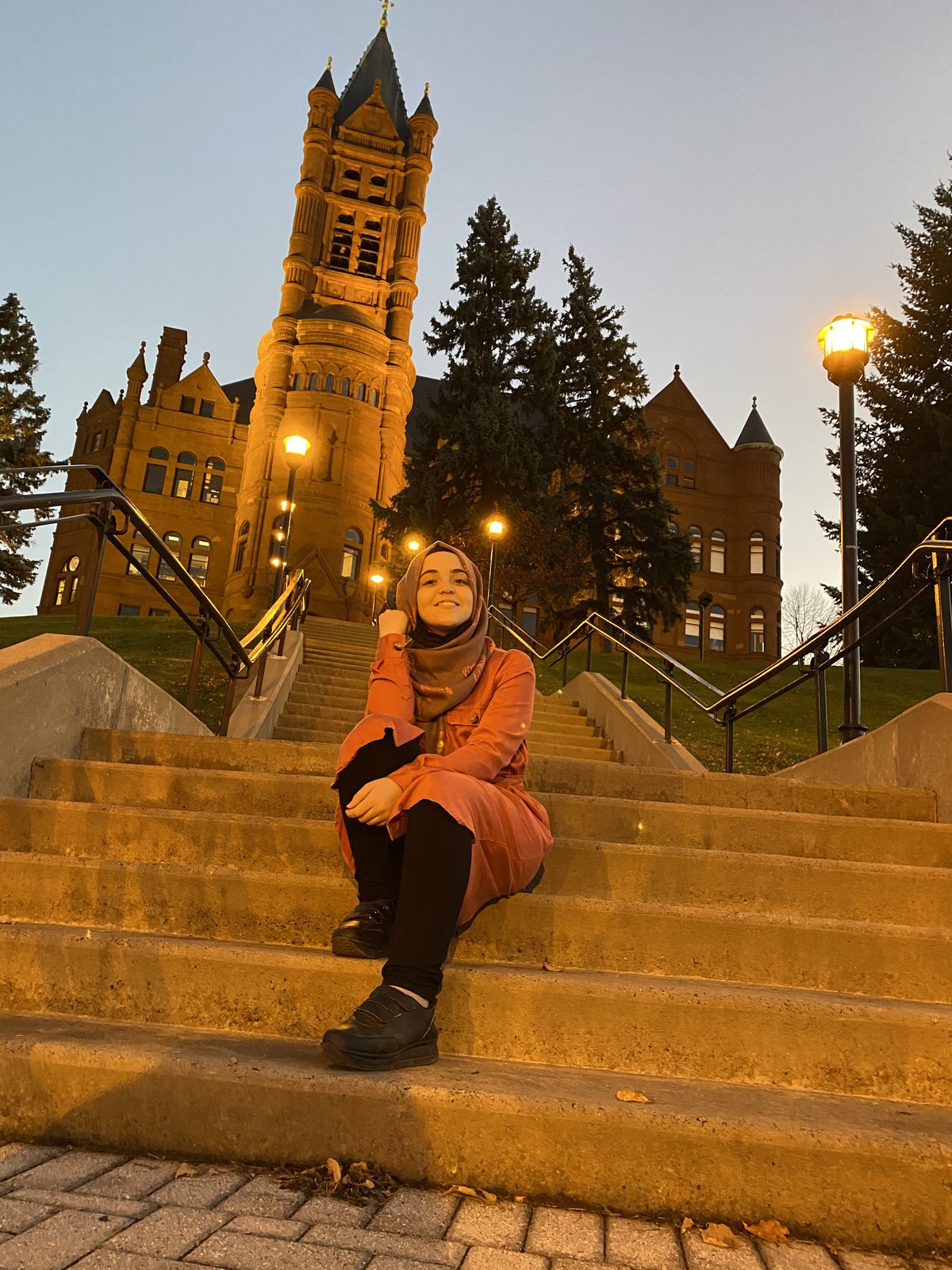 Nidaa Aljabbarin on the steps leading up to Crouse College.
