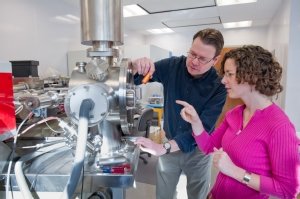 Scott Samson, professor of earth sciences, teaches a graduate student how to use one of two thermal ionization mass spectrometers in his laboratory