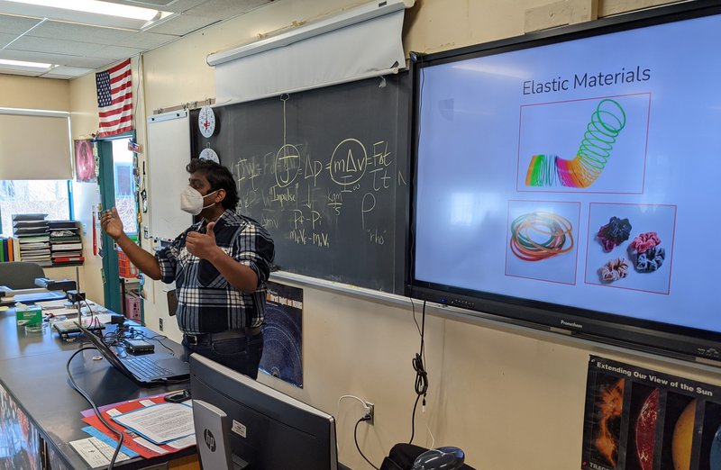 Sarthak Gupta presenting to a class about elastic materials.