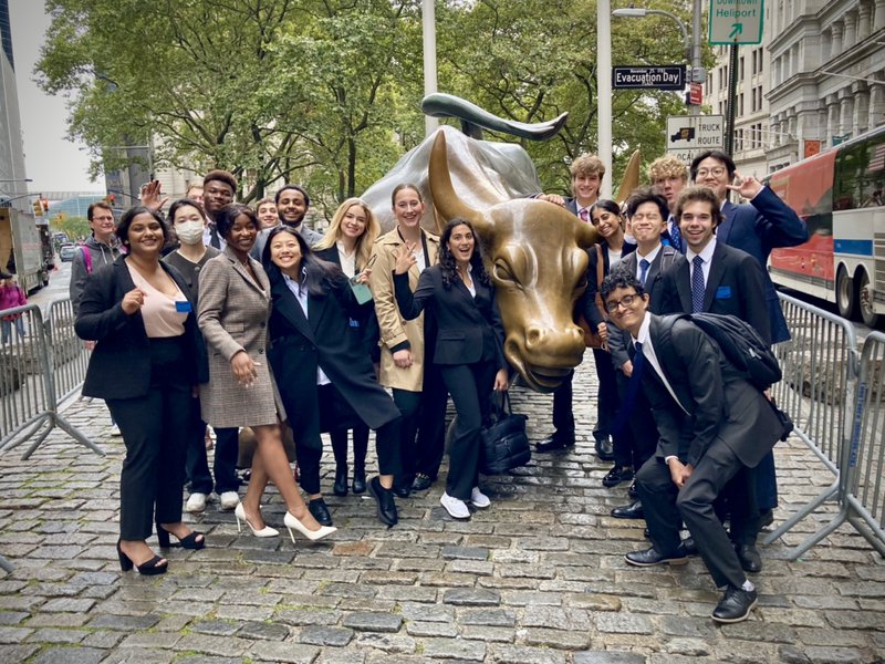 Students with Wall Street Bull.