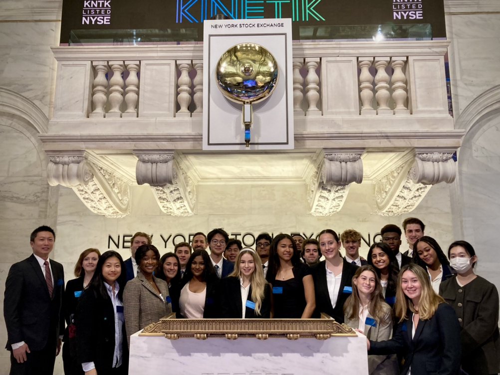 Students with stock exchange bell.