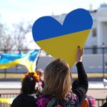 Person Holding Heart Shaped Sign with Ukraine Colors.jpg