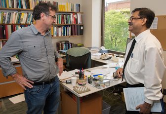 Syracuse physicist Mark Bowick (left) welcomes Calcutta vice chancellor Dhrubajyoti Chattopadhyay. 