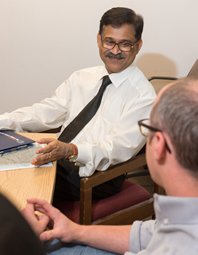 Chattopadhyay speaks with Syracuse chemist Mathew Maye. Maye's colleague Ivan V. Korendovych also contributed to the discussion.