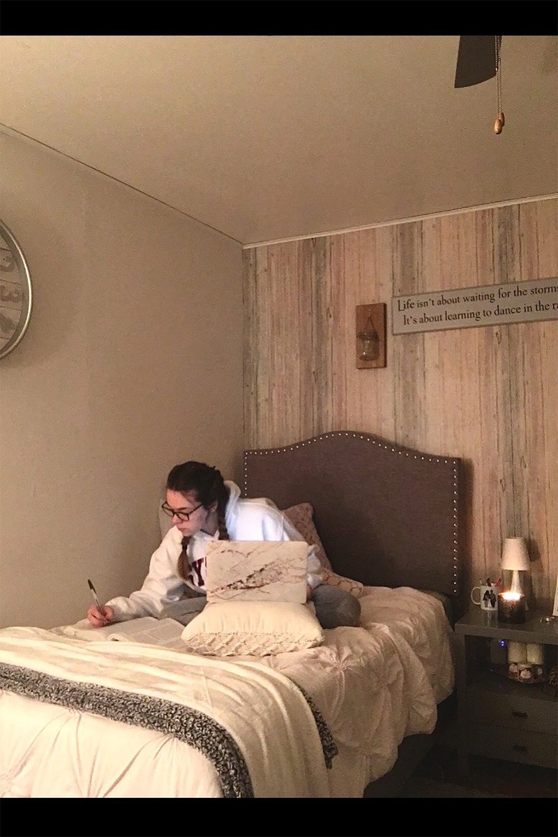 girl on bed with laptop