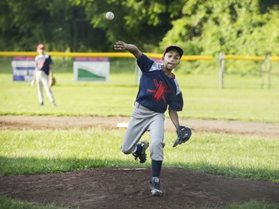 Marilu Lopez Fretts's photo of Jondale Dávila, star pitcher for Syracuse's District 8 Little League Baseball, is among those in La Casita's exhibition. 