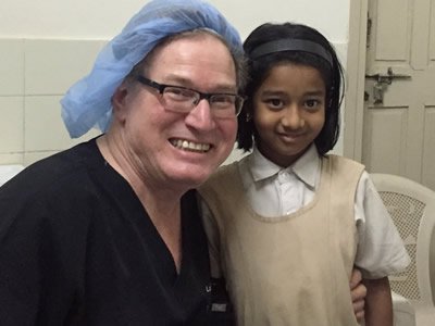 Larry Weinstein '75 and a patient during a recent mission trip to India. 